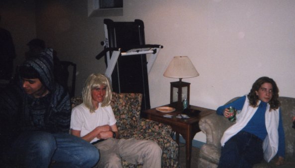 Gabe reminds me of Joe when he's in a women's wig.  Yessindeedee.  Perhaps someday we'll have enough pictures to do a 'Dorks in Drag' photo album.  That'd be humorous.  Well this particular dork is wearing the wig in Alec's basement during his New Year's Eve Party.